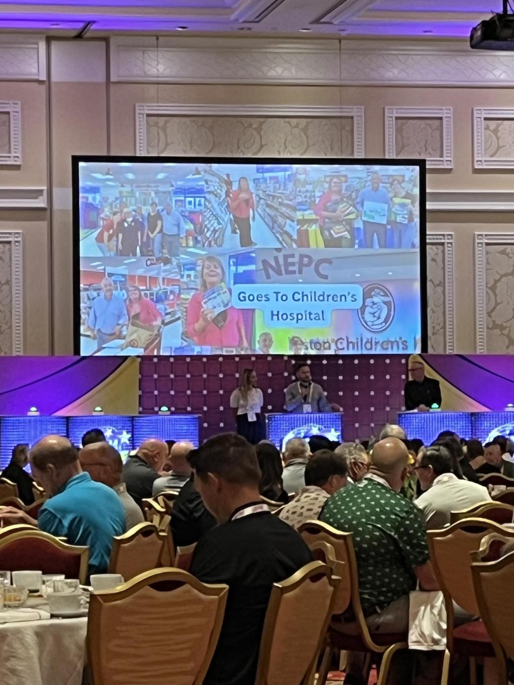 Audience at a seminar on Nepali culture and tourism in a conference hall.